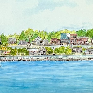 May include: Watercolor painting of a small town on a lake. The town has a variety of buildings, including a church, a hotel, and several shops. The lake is blue and there are trees and hills in the background.