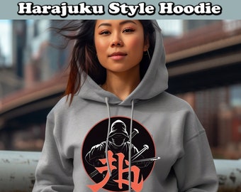 May include: A gray hoodie with a black circle graphic featuring a hooded figure holding two swords and a Japanese character in red. The text "Harajuku Style Hoodie" is printed on the hoodie.