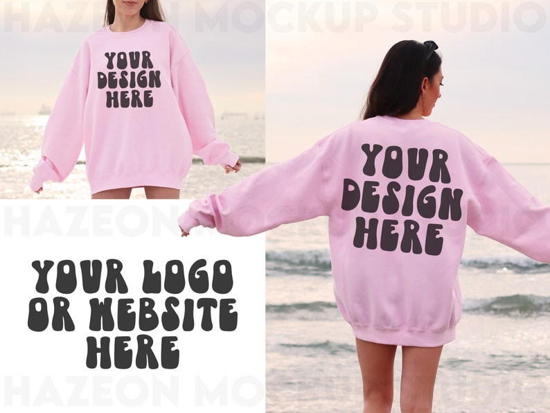 May include: A pink sweatshirt with the text "YOUR DESIGN HERE" in black on the front and the text "YOUR LOGO OR WEBSITE HERE" in black on the back. The sweatshirt is being worn by a person standing on a beach.