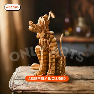 Puede incluir: Un rompecabezas de madera de un perro de dibujos animados. El perro está hecho de piezas de madera entrelazadas y está sentado. La imagen incluye el texto "ASSEMBLY INCLUDED" en una pancarta naranja. El logotipo de Only Arts Company está en la esquina superior izquierda.