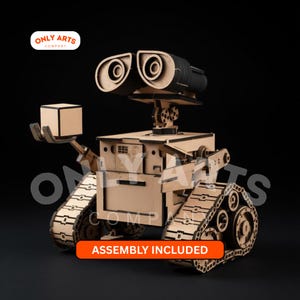 May include: A wooden model of a robot with large, binocular-like eyes, holding a small cube. The robot has a boxy body, articulated arms, and tank treads. The words "ASSEMBLY INCLUDED" are on an orange rectangle. The logo for "ONLY ARTS COMPANY" is in the upper left corner.