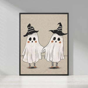 May include: Two white ghosts wearing black witch hats with orange shoes. The ghosts are holding hands and smiling.