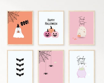 May include: Six printable Halloween themed wall art prints. The prints feature a ghost, pumpkins, bats, spiders, a cauldron, and the text "Boo!", "Happy Halloween", "Trick or Treat", "Spooky Vibes", and "Boo!"