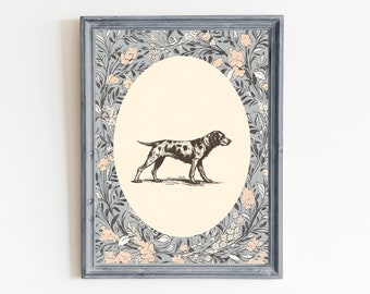 May include: A framed print with a black and white illustration of a dog in a circular frame. The frame is surrounded by a floral pattern in shades of blue, pink, and white.