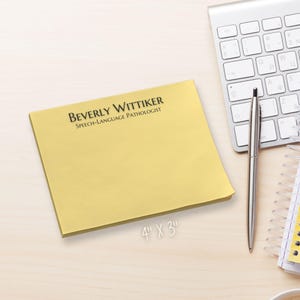 May include: A yellow sticky note pad with the text "BEVERLY WITTIKER SPEECH-LANGUAGE PATHOLOGIST" printed on the top. The pad measures 10.16 cm by 7.62 cm.