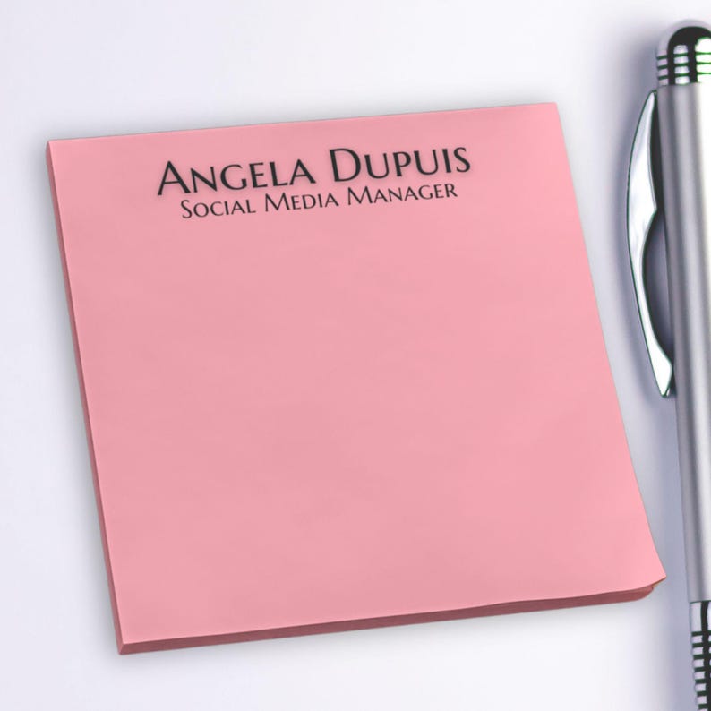 May include: A pink sticky note with the text "ANGELA DUPUIS SOCIAL MEDIA MANAGER" printed on it.
