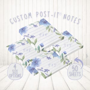May include: Four different sizes of custom Post-it® notes with a floral design featuring blue and purple flowers. The notes are labeled with the size in inches, such as 4" x 4" and 4" x 3". The notes also have the name "Susan" printed on them. The notes are stacked on top of each other and there is a white wooden background. The text "50 SHEETS" is visible in the lower right corner of the image.