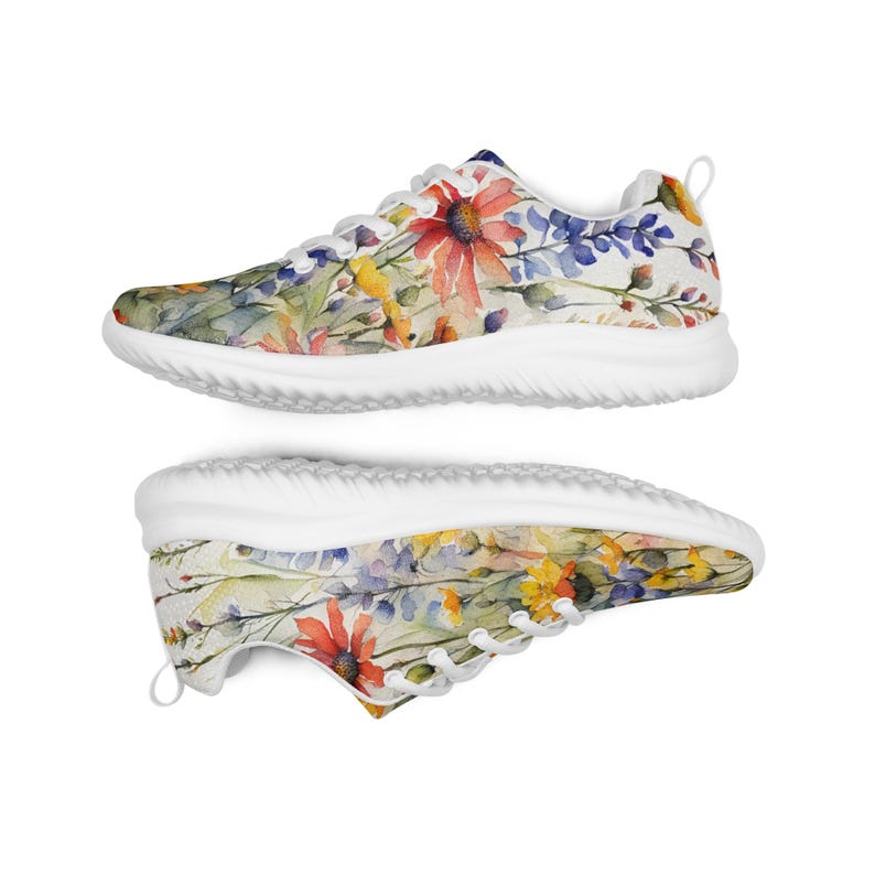Women's Watercolor Wildflowers Sneakers : Athleisure Casual Shoes, Lightweight, Lace-up, Floral, Flowers. Vibrant watercolor wildflowers in shades of orange, blue, yellow, and pink, with green leaves and foliage, against a crisp white background. Bright white inner and outer soles, trim and shoelaces. The upper is a ultralight knit weave. These casual shoes are perfect for travel, shopping, running errands or just hanging out. Super lightweight and comfortable.