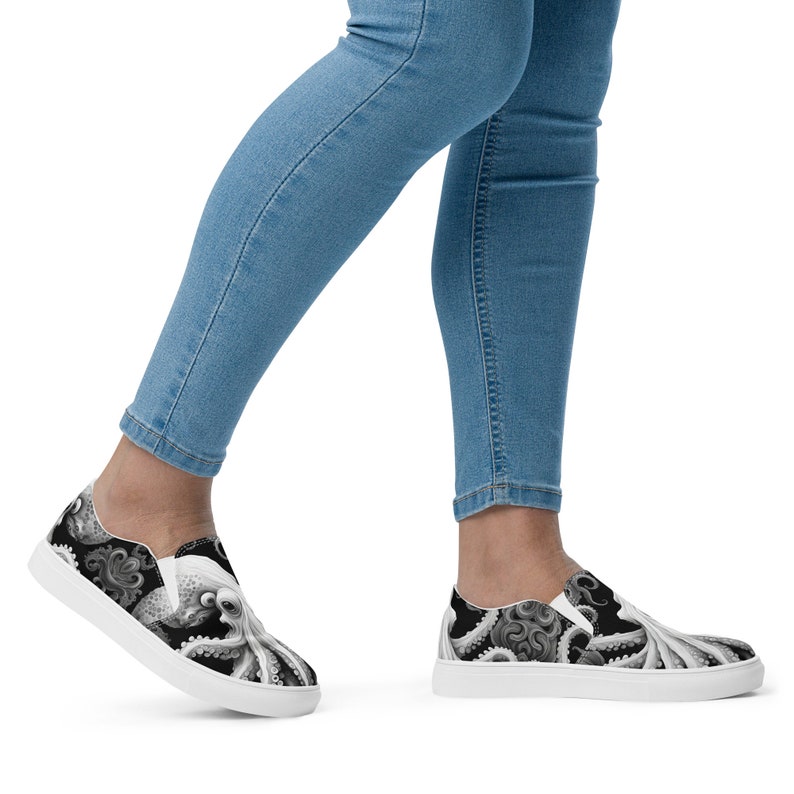 Black, white and grays combine to create these swirling, tentacled arms of this sea monster. Kraken? Octopus? Squid?  The pattern covers the front, side and back panels. The monster peeks over the heels to leave a lasting impression as you walk away.