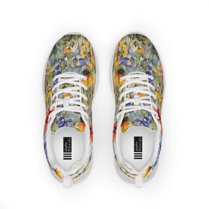 Women's Watercolor Wildflowers Sneakers : Athleisure Casual Shoes, Lightweight, Lace-up, Floral, Flowers. Vibrant watercolor wildflowers in shades of orange, blue, yellow, and pink, with green leaves and foliage, against a crisp white background. Bright white inner and outer soles, trim and shoelaces. The upper is a ultralight knit weave. These casual shoes are perfect for travel, shopping, running errands or just hanging out. Super lightweight and comfortable.