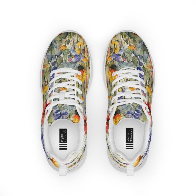 Women's Watercolor Wildflowers Sneakers : Athleisure Casual Shoes, Lightweight, Lace-up, Floral, Flowers. Vibrant watercolor wildflowers in shades of orange, blue, yellow, and pink, with green leaves and foliage, against a crisp white background. Bright white inner and outer soles, trim and shoelaces. The upper is a ultralight knit weave. These casual shoes are perfect for travel, shopping, running errands or just hanging out. Super lightweight and comfortable.