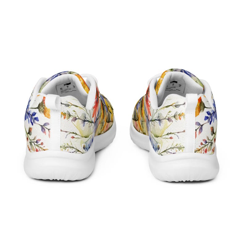 Women's Watercolor Wildflowers Sneakers : Athleisure Casual Shoes, Lightweight, Lace-up, Floral, Flowers. Vibrant watercolor wildflowers in shades of orange, blue, yellow, and pink, with green leaves and foliage, against a crisp white background. Bright white inner and outer soles, trim and shoelaces. The upper is a ultralight knit weave. These casual shoes are perfect for travel, shopping, running errands or just hanging out. Super lightweight and comfortable.