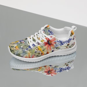 Women's Watercolor Wildflowers Sneakers : Athleisure Casual Shoes, Lightweight, Lace-up, Floral, Flowers. Vibrant watercolor wildflowers in shades of orange, blue, yellow, and pink, with green leaves and foliage, against a crisp white background. Bright white inner and outer soles, trim and shoelaces. The upper is a ultralight knit weave. These casual shoes are perfect for travel, shopping, running errands or just hanging out. Super lightweight and comfortable.