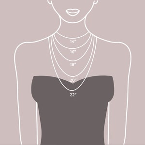 May include: Diagram showing different necklace lengths on a model wearing a black strapless dress. The lengths are 14 inches, 16 inches, 18 inches, 20 inches, and 22 inches.
