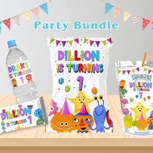 May include: A party bundle featuring a water bottle, snack bag, juice pouch, and candy bar, all decorated with colorful cartoon characters and the text "Drake is Turning 1" and "Dillion is Turning 1". The items are arranged on a wooden surface.