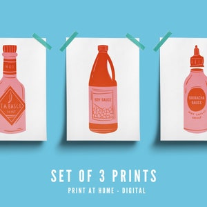 May include: A set of three digital art prints featuring illustrations of condiment bottles. The first print shows a Tabasco sauce bottle, the second a soy sauce bottle, and the third a Sriracha sauce bottle. The text reads SET OF 3 PRINTS PRINT AT HOME - DIGITAL.