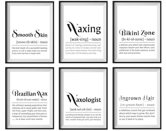 Puede incluir: Seis impresiones enmarcadas con marcos negros y fondos blancos. Cada impresión presenta una palabra diferente relacionada con la depilación con cera, como "Smooth Skin" y "Brazilian Wax", junto con una definición. El texto está en una fuente elegante.