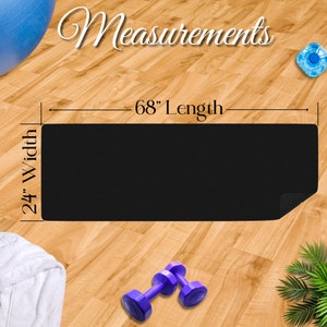 Measurements: a black mat lying in the center of a gym showing 68 in length by 24 in width.