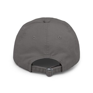 May include: A solid gray baseball cap with a buckle closure on the back.