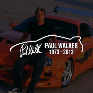 May include: A graphic print featuring a person in a black t-shirt and blue jeans leaning against an orange sports car. The text reads Paul Walker 1973-2013 with a signature graphic overlay. The car has a rear spoiler and silver wheels.