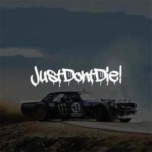 May include: A black Ford Mustang drift car with the number 43 and Monster Energy branding, performing a drift on a track with smoke. The white text JustDontDie! is overlaid in a stylised, dripping font across the centre of the image.