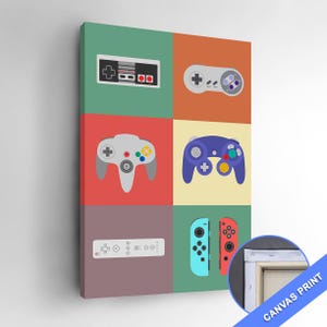 May include: Canvas print featuring a grid of six colorful squares, each displaying a different video game controller. Controllers include a classic NES controller, a gray and white controller, a gray N64 controller, a purple controller, a white remote, and two Joy-Con controllers.