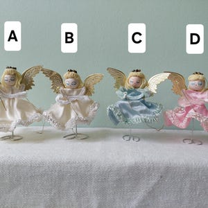 Vintage angels on wirestand, with spun cotton heads. Japan, 50s. Sold individually.