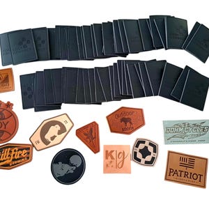 May include: Assortment of leather patches with various designs and text, including "Still Fire Brewing", "DOY 2014", "Outdoor Athlete", "John Cycles", "Patriot", and "Kig".