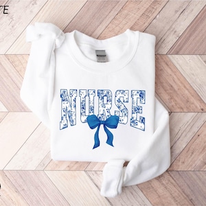 Nurse Bow Sweatshirt, Gift for Nurse, Floral Nurse Hoodie, Registered Nurse Tee, Nurse Ribbon Shirt, Nurse Appreciation, Coquette Bow Shirt
