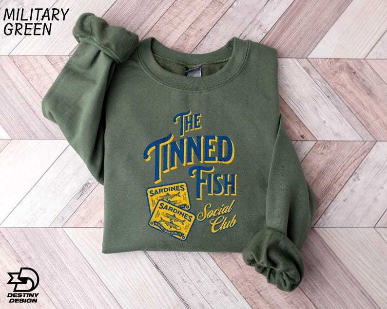 a green sweatshirt with the words the tunad fish on it