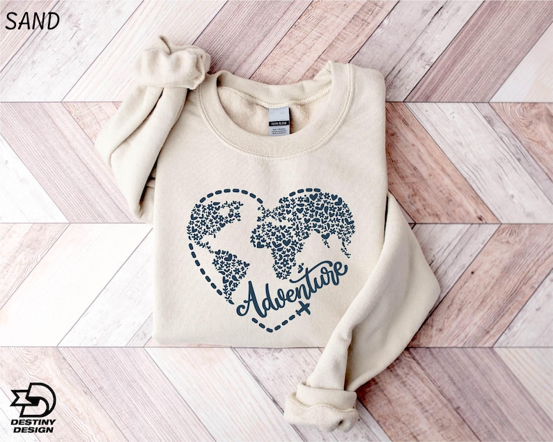 a sweater with the words adventure printed on it