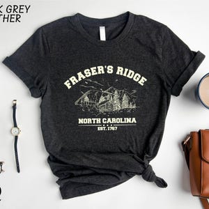 a black t - shirt with a picture of a pirate's ridge north carolina