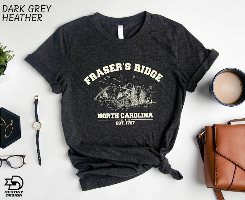 a black t - shirt with a picture of a pirate's ridge north carolina