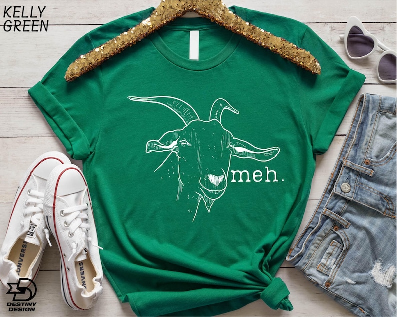 a green t - shirt with a picture of a goat on it