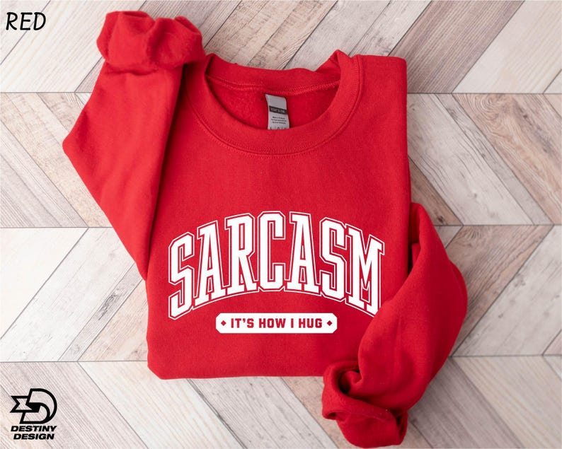 a red sweatshirt with the word sarcasm on it