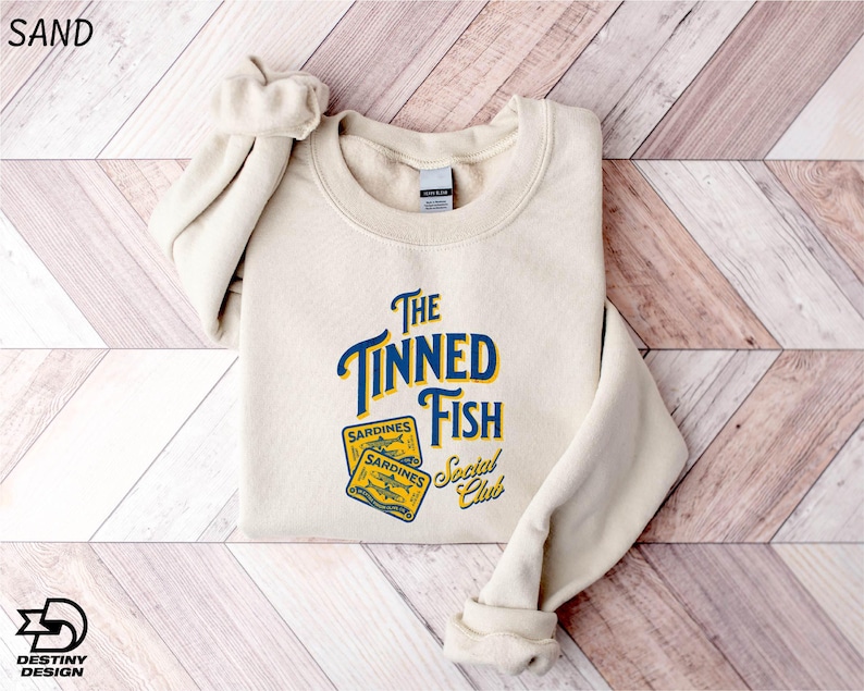 a white sweatshirt with the words the tunad fish on it