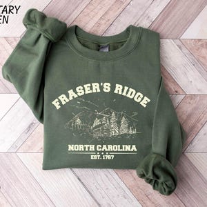 a green sweatshirt with the words fraser's ridge on it