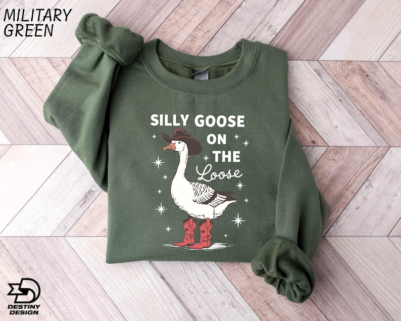 a green sweater with a goose on the side