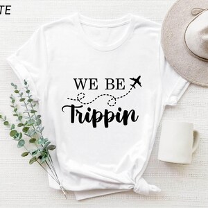 a t - shirt that says we be tripin