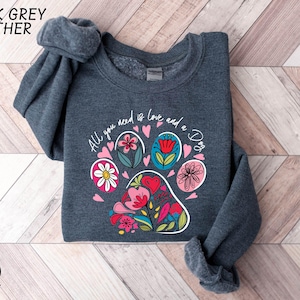 a sweatshirt with a dog's paw painted on it