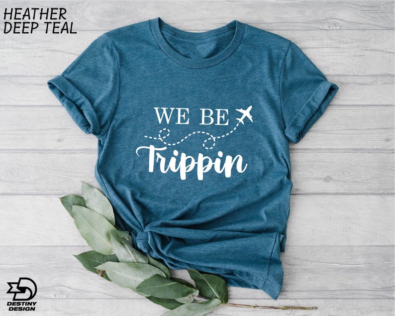 a t - shirt that says we be tripin on it