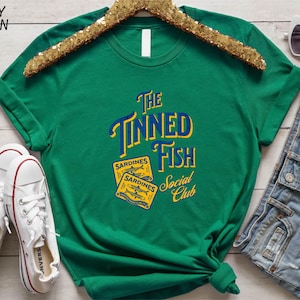a green t - shirt with the words the sponged fish on it