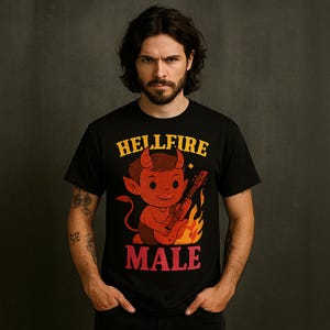 May include: Black t-shirt with a cartoon devil playing a guitar in front of flames. The shirt has the words "HELLFIRE MALE" in yellow and red lettering. The image is of a person wearing the shirt.
