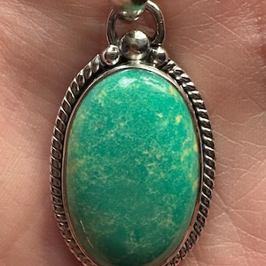 Super rare top quality carico lake turquoise pendant set in .925 silver.