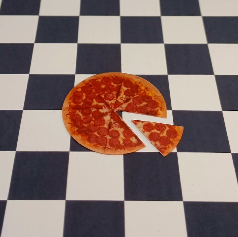 May include: A pepperoni pizza on a black and white checkered surface. The pizza is cut into slices, with one slice removed.