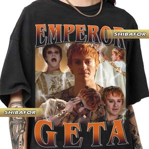 May include: Black t-shirt with a graphic print of a man's face with the text "Emperor Geta" and "Shibafor" in orange and black.