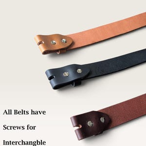 May include: Three leather belts in tan, black, and dark brown, each featuring two metal screws at the end for interchangeable buckles. The text on the left reads: All Belts have Screws for Interchangble Buckles.