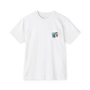 May include: White t-shirt with a pocket featuring a colorful graphic. The graphic includes text and an illustration of a person with an umbrella. The shirt is made of a soft, comfortable material.