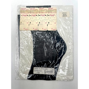 May include: Black hosiery in original packaging. The package includes multiple price tags and a label that reads "4784-01 BLACK MEDIUM." The text "MADE IN ENGLAND ESPECIALLY FOR fredericks of Hollywood" is also visible.