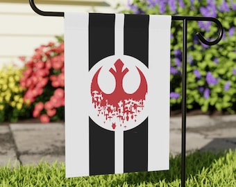 May include: A white garden flag with black stripes and a red Rebel Alliance symbol. The symbol is distressed and appears to be dripping.